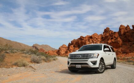 parked white Ford Explorer SUV